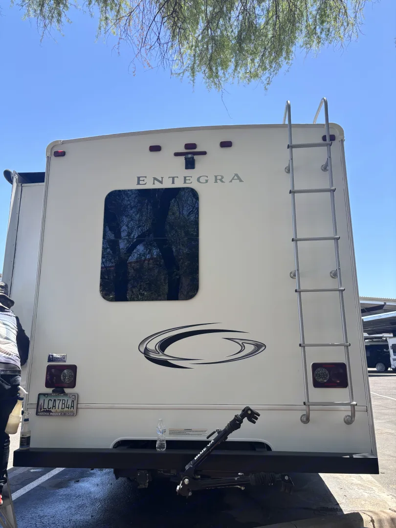 Entegra Coach Odyssey rear exterior with rear window and ladder